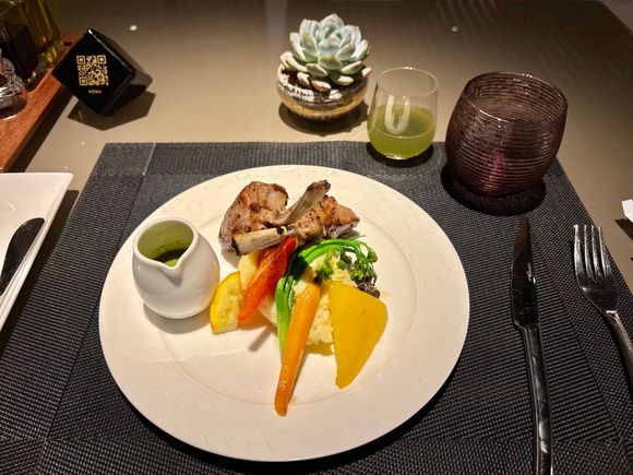 Lamb chops were also divine and cooked perfectly medium rare. Might be the best dish I’ve ever had in a QR lounge.