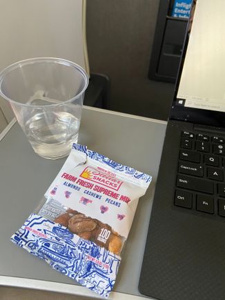 I got to show you what I deal with for all the AA apologetics here. YYC-DFW. 3 hours+  1500mi+. this was it. water cup size of what you get at dental office to rinse your mouth. FA disappeared after and didn't even refill the water. pack of nuts. nice job AA killing it as usual