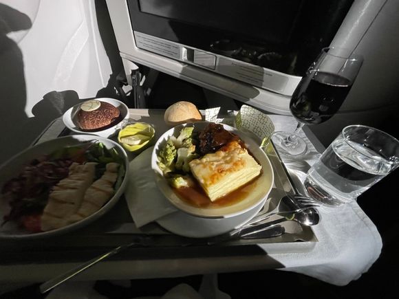 Executive class dinner, 10/12/2025, flight 204, EWR to LIS.
Appetizer - green salad with chicken and (I believe) grains, eg quinoa
Main course - beef tenderloin, scalloped potatoes, broccoli, roll and butter
Dessert - chocolate mousse presented on a chocolate wafer
All in all, pretty good, especially the beef and potatoes.  I found the dessert too rich, but can see others would like it.
