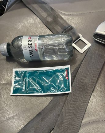 Bottle of water and a wipe next to my seat 