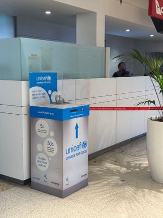 Here you go- this one was next to the Qantas customer service desk near gate 1 of T1. There were further boxes at most but not all gates