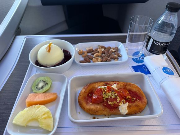 Into FCO - menu only on some seats and not of this meal. Sachet sugar again. Interestingly. The pizza thing looks vary similar but is different (cheese etc)