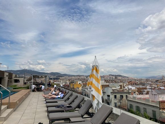Sunbeds next to the pool : these face west wards, looking to the right eastwards you can spot the basiliqa Sagrada Familia
