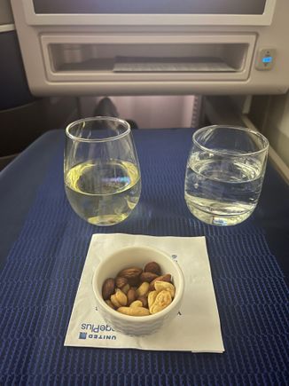 Nuts served warm, even in row 15. Water was proactively offered in addition to main drink requests. 
