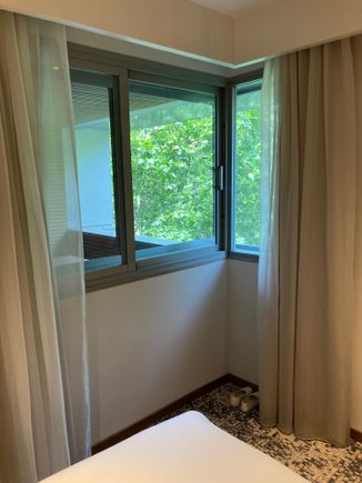 Window can be opened and comes with blackout curtains