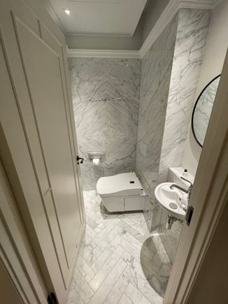 Your knees will fight the wall for space, but hey, at least there is a Toto!