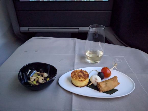 Warm nuts, champagne, canapes (hot items were both hot and crisp, cold were served nice and chilled)