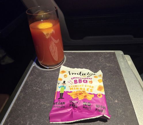 Beverage with nibbles to start the meal.