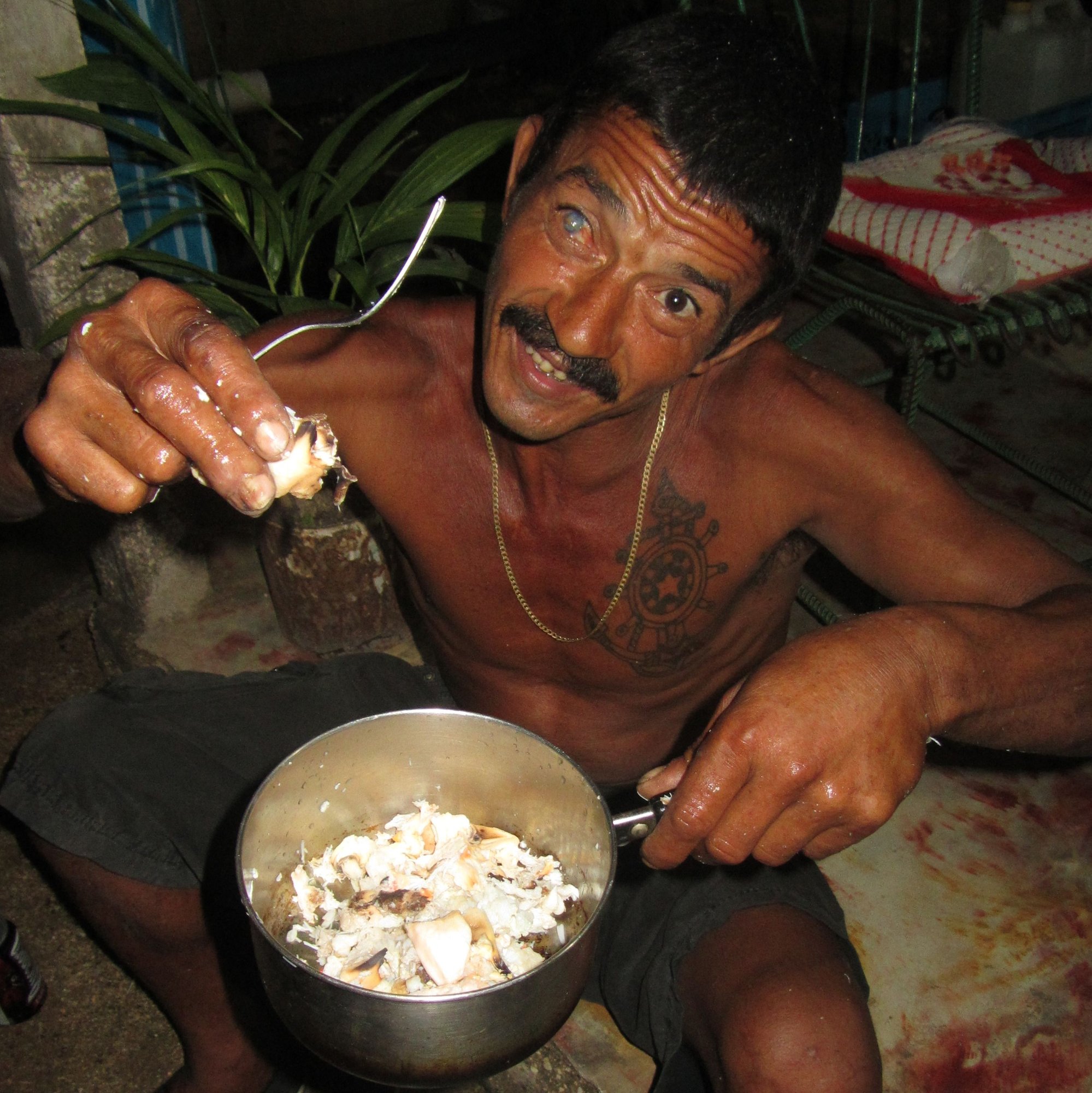 A one-eyed Cuban friend of ours cracking open crabs in the back patio of our casa to fill a pot full of crab meat as part of our New Years Eve feast and festivities. I always contribute the pig, and the others contribute whatever they can bring. This guy is a fisherman who just got back from Playa Santa Lucia that morning with his booty from the sea to share with everyone. Yummy! 