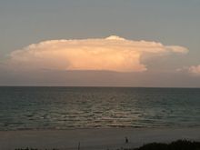 This cloud over the ocean tonight looks like a spaceship, I think.