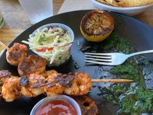 This was the best shrimp I have ever eaten in my life, perfectly grilled and served with a salsa verde, grilled lemon, wonderful coleslaw. Also in the upper right is rockfish ceviche. My wife had a perfectly cooked grilled swordfish sandwich. Great meal at Mitch’s. Also, though it’s a shack type of place there are real dishes and silverware, which really enhances food. If parking were not such a PIA I’d eat there repeatedly.

Great beer menu too but it was a bit early for us.



