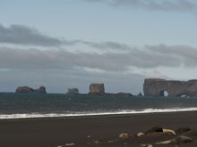 Dyrhólaey seen in the distance on a clear day.