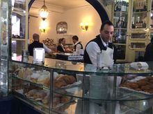 Making and selling their famous pastel de natas (egg custard tarts). Belem,  Lisbon Portugal