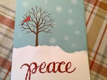 They had to do more stamping on this one and tear the white paper to make a snowbank. I told them given the world situations I had to make a peace card.