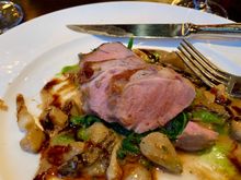 My meal consisting of deliciously tender pork tenderloin in a morel and onion cream sauce. 