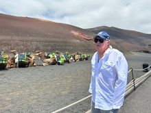 Camel averse tourist, befuddled by the sight of a lineup of African animals awaiting tourists to take a ride.   This is before reaching the visitor's center.  Are we really in Spain?