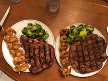 Valentines meal tonite. Prime beef rib eye steak, shrimp skewer and broccoli with Hollandaise sauce.