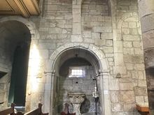 Old arches inside show various stages of building