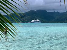 Our ship with the island of Taha’a in the background 