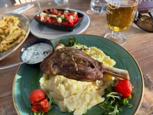 Ed ordered lamb shank with mashed potatoes.