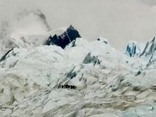 See the tiny people walking on the glacier