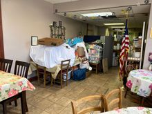 So, I have a weakness for small businesses. And start up businesses. And mom and pop restaurants. In Winterset Iowa we were looking for food. While walking around their sidewalk sign seemed to fit the weaknesses perfectly.  This is the decor were were greeted with. 6 tables, a 'path' to the restroom and kitchen and this decor. The food was excellent but the waiter was scary.