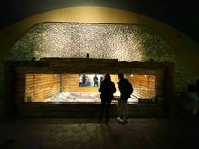 Shows how the tomb was structured inside. The tomb was encased by stones and sealed, then covered with concrete, then grass. 