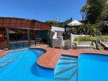 The outdoor pool next to the indoor pool