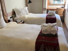 Our small twin room (rivals the small hotel rooms in Japan). Bathrobes and slippers provided for rooms with shared baths. 