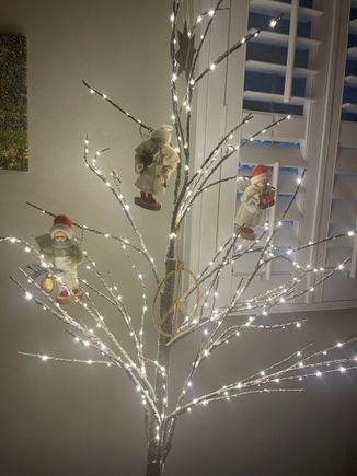 Hung my kids on this tree. Ha!! These are 3 porcelain angels my sister gave me years ago because they resembled my own kids.  