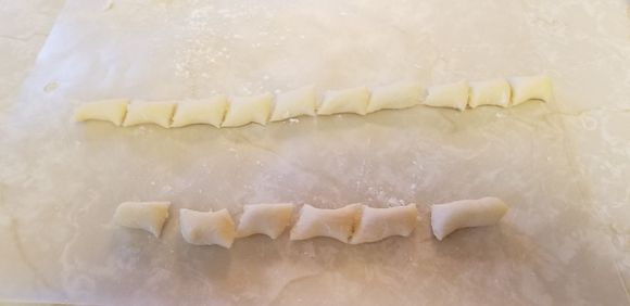 Cutting the dough strips into  nice pieces !