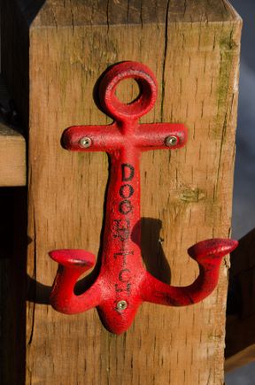 A dog post by a popular cafe.