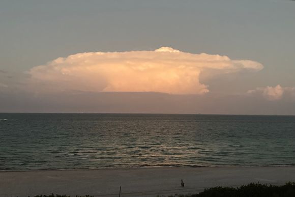 This cloud over the ocean tonight looks like a spaceship, I think.