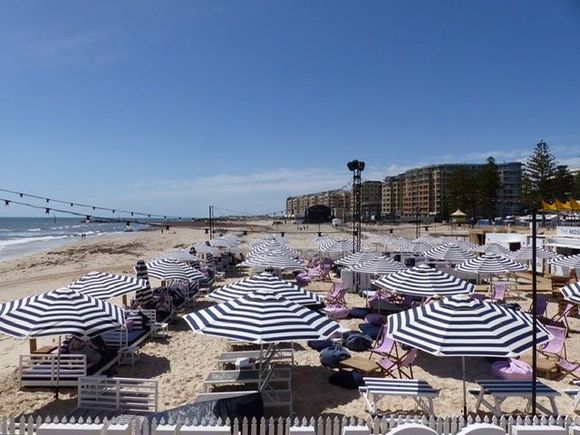 The preparation for concert, stage being set up on beach. 