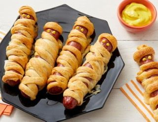 Crescent roll strips wrapped around hot dogs.  