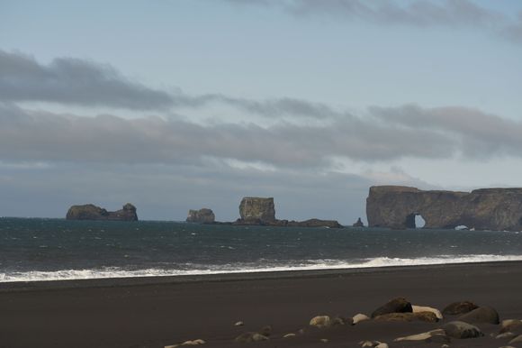 Dyrhólaey seen in the distance on a clear day.
