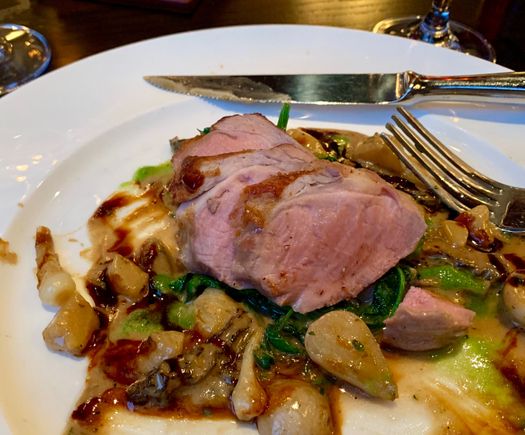 My meal consisting of deliciously tender pork tenderloin in a morel and onion cream sauce. 