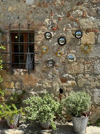 I love the contrast of old stone with greenery . . .