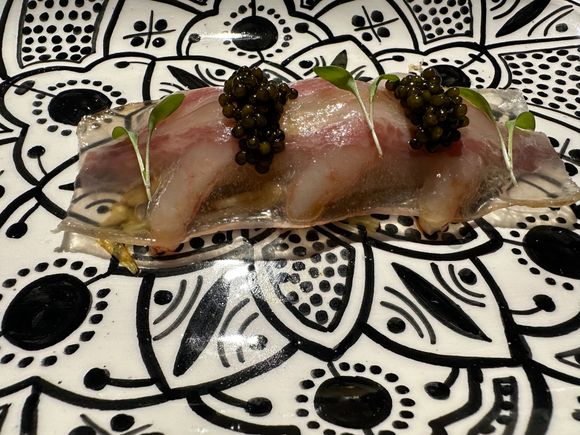 Set upon a bed of very thickly sliced, braised endive strips, a trio of raw gambas draped with gossamer slices of Joselito ham that was, in turn, crowned by two lavishly sized spoonfuls of black caviar, which I am again assuming comes from the RioFrio Farms near Granada.    A regal and inventive dish,  this filled my mouth with an explosion of exquisite flavors such as I've never before encountered.....on this dish. alone, Paco Morales will be enshrined with the culinary greats of the ages!!!   