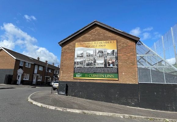 The peace wall is at the far right. The metal fixtures in the backs of the houses was to deflect Molotov cocktails thrown over the wall. Today, people through blue and red golf balls.