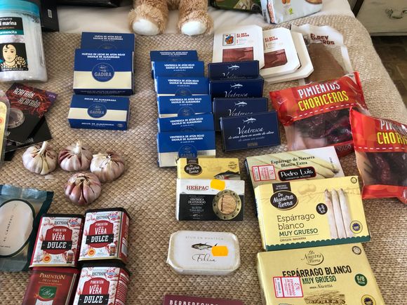 Blue boxes are the conservas of tuna and other fish; I brought about 20 boxes of these in my suitcase and shipped these (on the bed in my room) home.