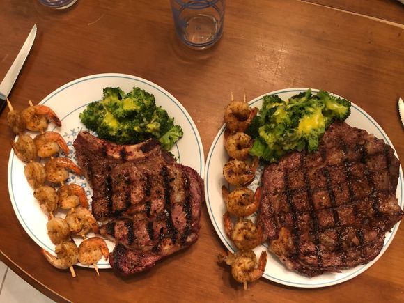 Valentines meal tonite. Prime beef rib eye steak, shrimp skewer and broccoli with Hollandaise sauce.