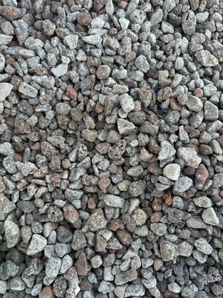 Surface of Rinella beach closer to the sea, the pebbles get much smaller and the slope to the water is very steep.   Water shoes are a MUST!!