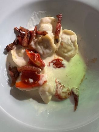 One of the standout dishes of the trip so far:  Partner's fresh tortilla stuffed with a stracotto (stew) of black piglet (likely from the Nebrodi Mountains, where 
Sicily's most lauded pigs are bred.  Bathed in a Pecorino-based sauce and topped with divine cherry tomatoes and crispy and delicious slices of guanciale (pig jowl, most commonly used as an ingredient in pasta all carbonara, quintessential dish off Rome and all of Lazio)