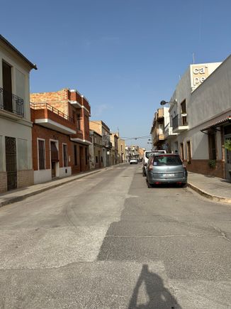 Main Street of Alqueria La  Roca/Meliana with unassuming front of restaurant at right