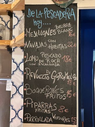 Chalkboard listing daily specials; most staff speak perfect English