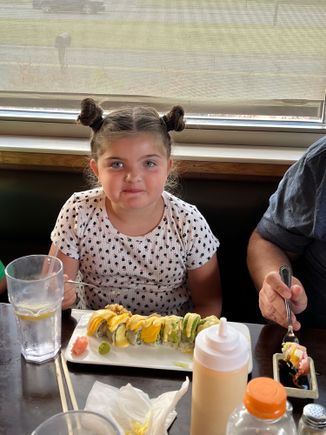 miss Maya not so sure about sushi. But she ate it.me