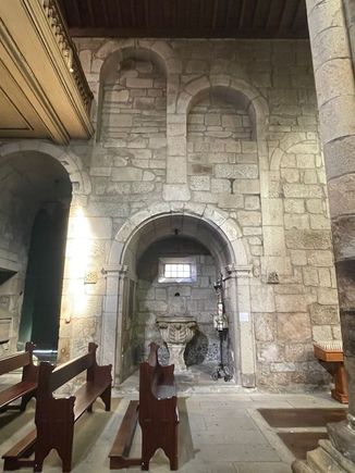 Old arches inside show various stages of building