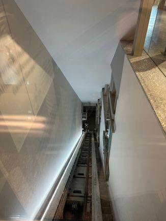 The elevator was on an incline, echoing the siting of the building, and reminded me of a cable car...it was fun to ride up and down!!  