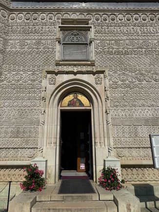 The exterior is carved all over with chevrons, meanders, and rosettes. Very intricate. Looks like lace.